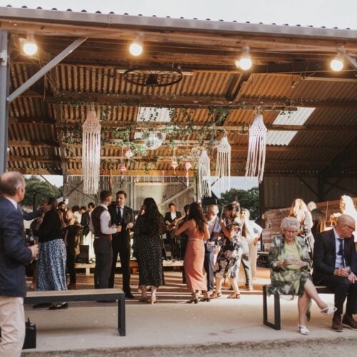 People gathered inside the Rustic Barn at Drovers Rest